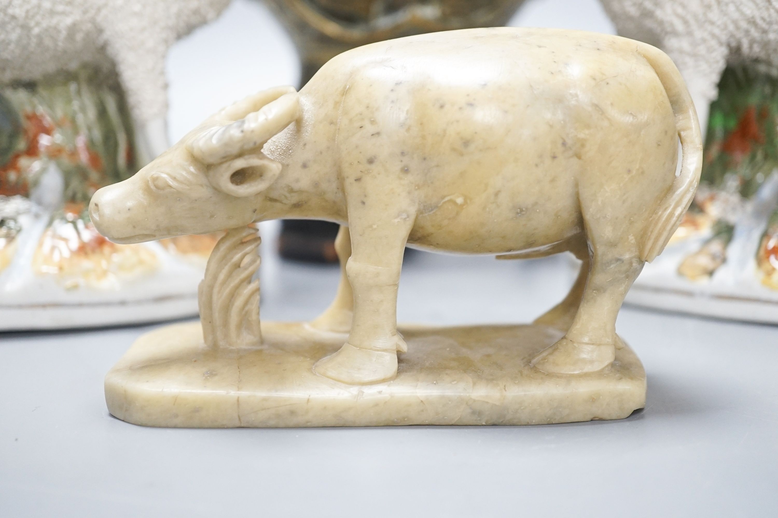 A Chinese bronze vase on stand, a soapstone figure of an ox and pair of Staffordshire sheep spill vases, 19cm